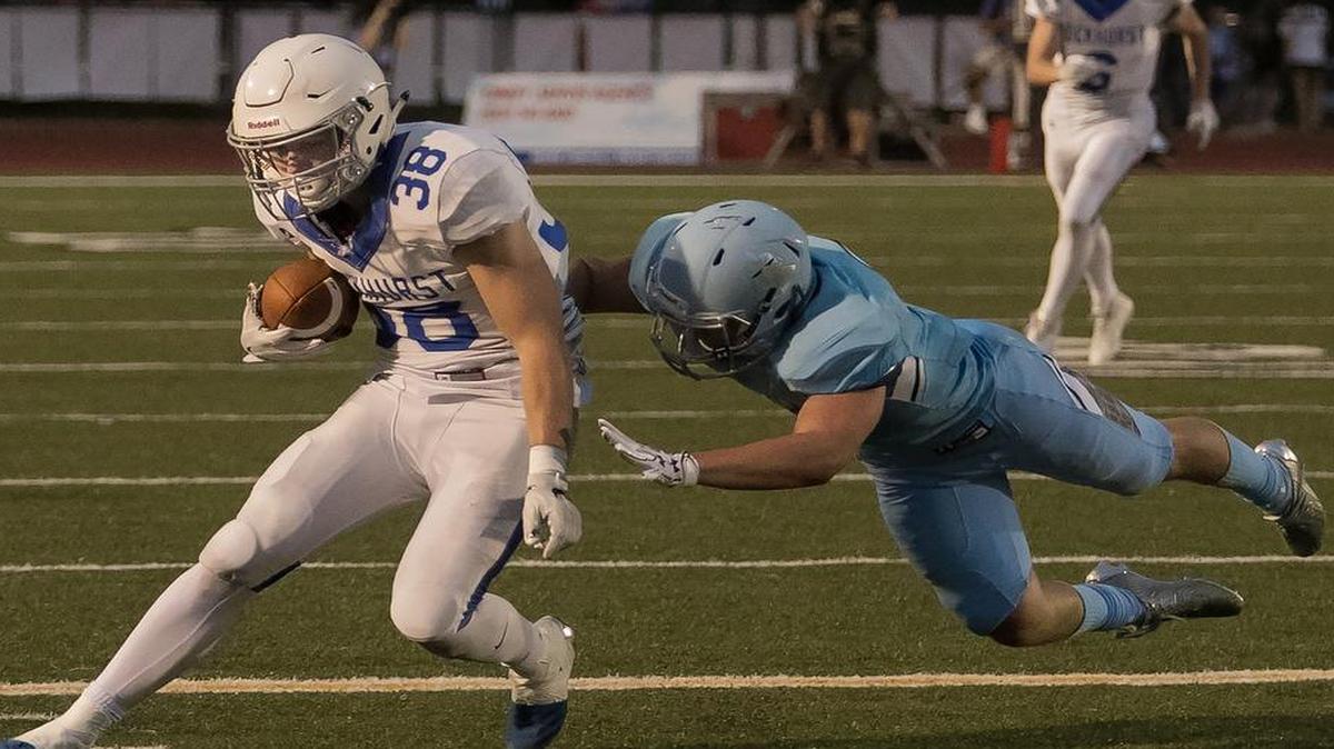 Brady McCanles (left) scored three TDs for Rockhurst in Friday’s victory over Rockhurst.