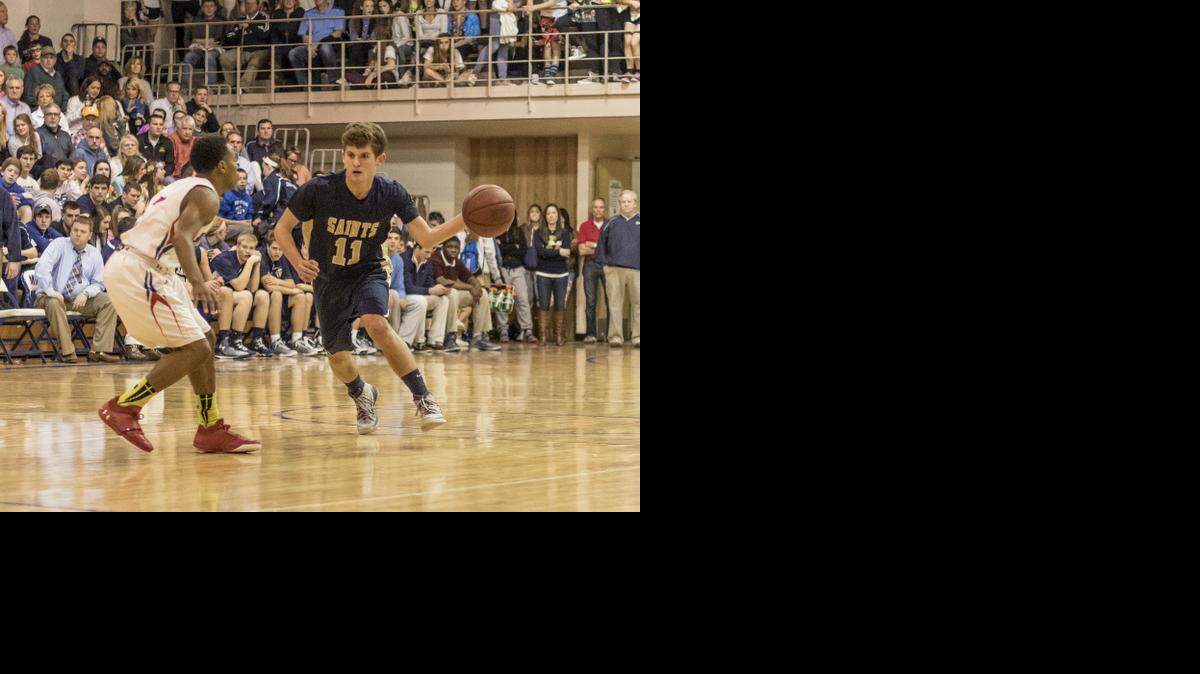 
St. Thomas Aquinas guard Cole Friedman looked for an opening against Bishop Miege during their game on Friday night. Aquinas will play host this week to the Saints Classic basketball tournament.
