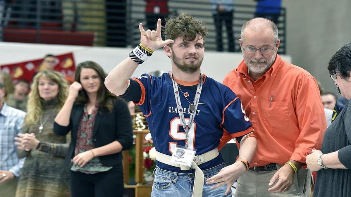 James McGinnis, a former football player at Olathe East High School, spoke on Tuesday at the Thomas A. Simone Awards program at Fort Osage High School. He was introduced prior to the presentation of the Nathan Stiles Inspiration Award.