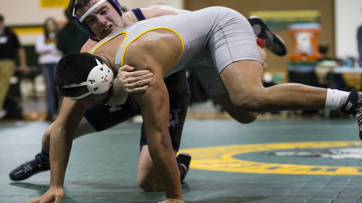 Jose Montoya (front) of Shawnee Mission West, seen here in last year’s Shawnee Mission South Invitational, won a weight class title at the BVNW Husky Invitational last week.