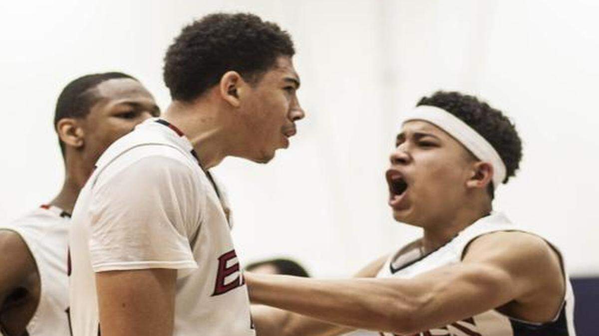 
Olathe North’s RJ Smith (left) celebrated with teammate Storey Jackson after Smith’s three-point play proved to be the winning margin against Blue Valley North on Friday night at Olathe North High School. Olathe North won the substate final, 57-56.

