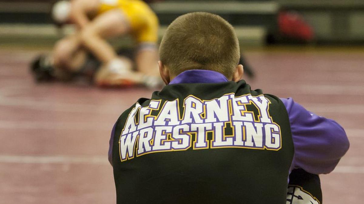 A member of the Kearney wrestling team sat and watched a fellow teammate compete during the Lee's Summit North wrestling tournament on Saturday.