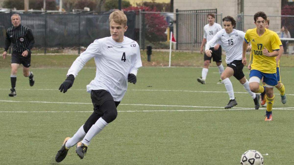 Blue Valley West senior forward Noah Mabry (center) led the Jaguars to a Kansas Class 6A soccer title in October. He scored 40 goals this season, breaking a record formerly held by MLS player Nick Besler.