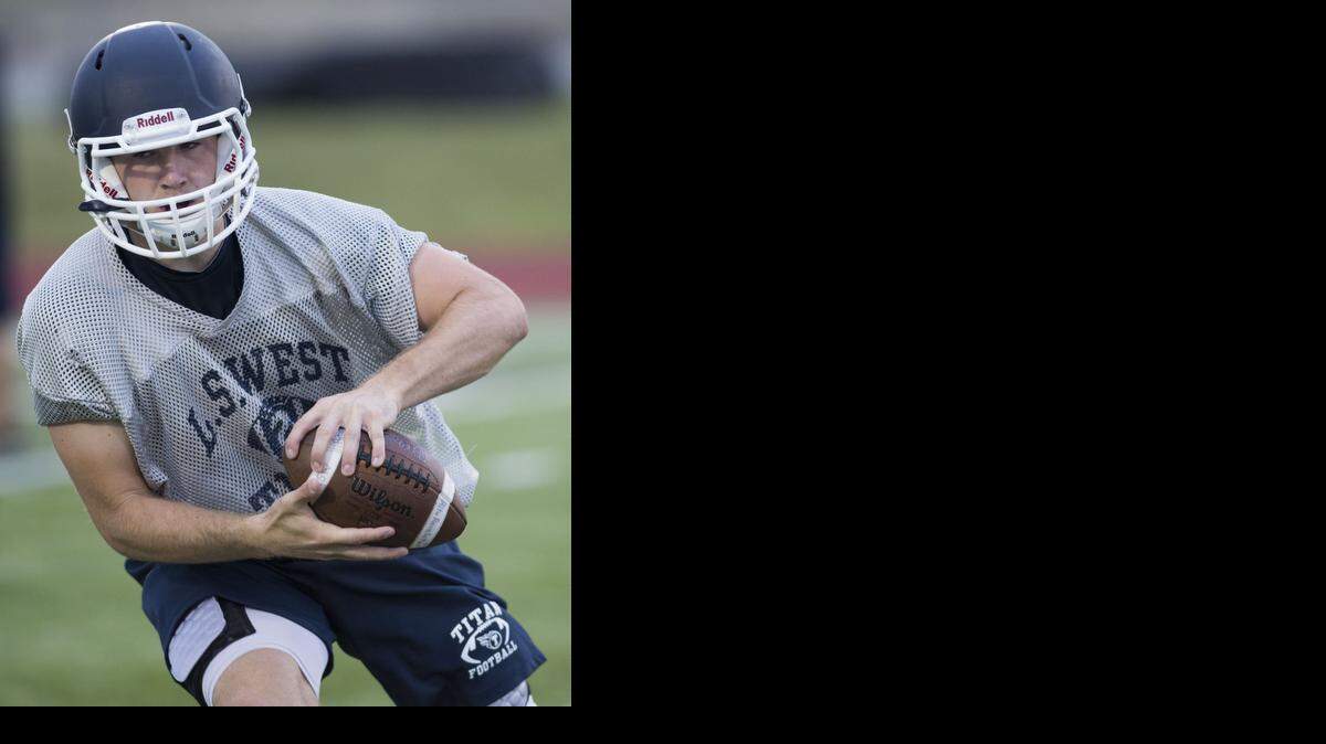 
Wide receiver Brenner Clemons of Lee’s Summit West caught a pass at the Titans’ first practice earlier this month on the school’s football field.
