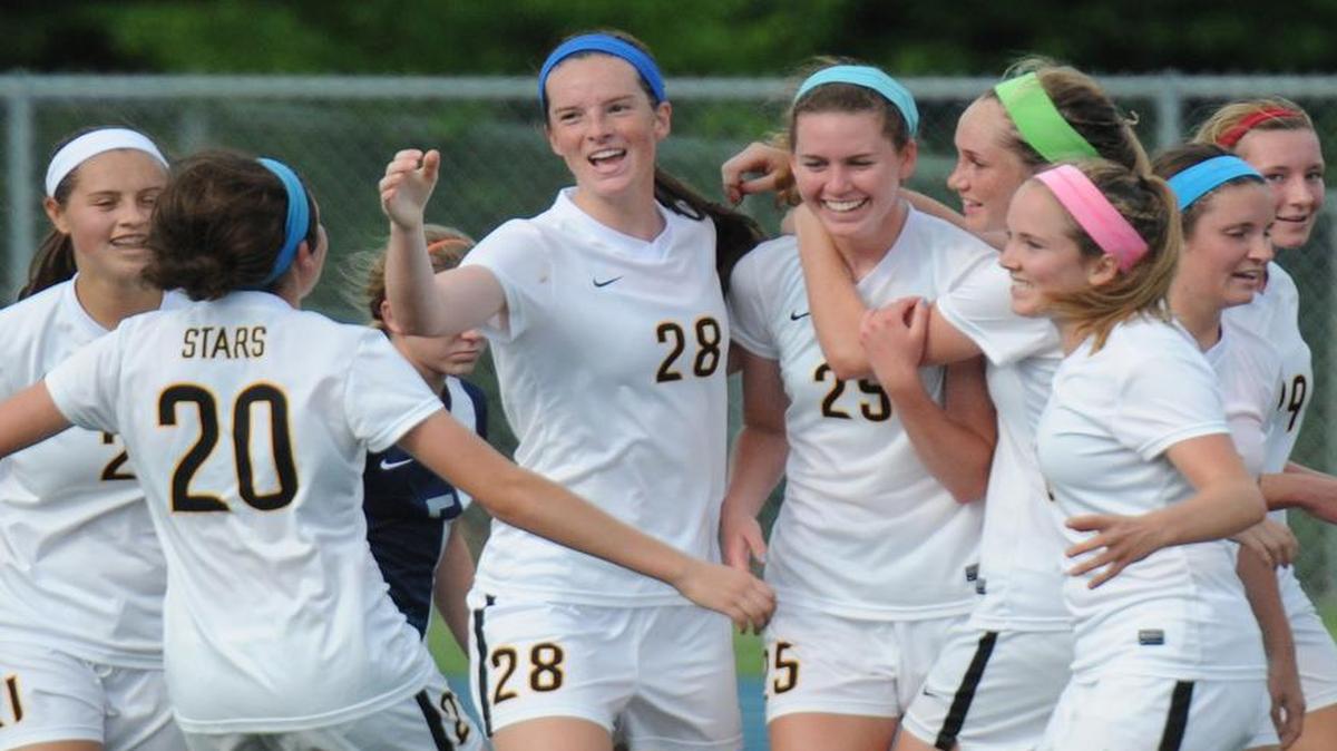
St. Teresa’s Academy teammates celebrate their third goal of the match against Francis Howell Central on Saturday at Blue Springs South High School. St. Teresa’s won the game, 6-1, and was crowned the Missouri Class 4 state champion.
