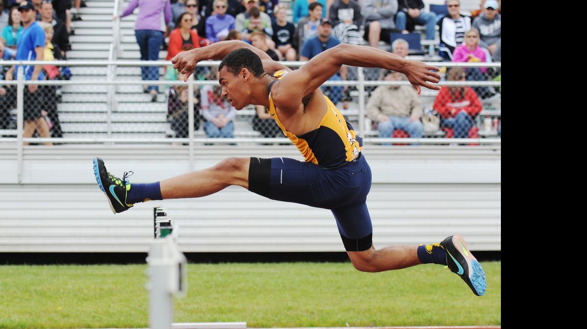 
Liberty North’s Andrew Madison soared over a hurdle during the 110-meter hurdles race on Saturday at the sectional meet at Staley High School.
