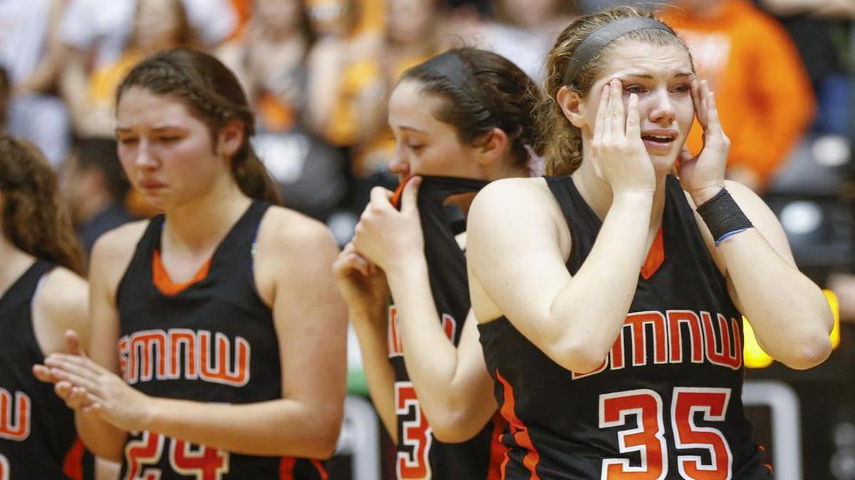Shawnee Mission Northwest’s (left to right) Jordan Nachbar, Gena Ojeda and Benni Rose react to the Cougars’ 36-30 loss to Wichita South in the Kansas Class 6A state title game on Saturday in Wichita.