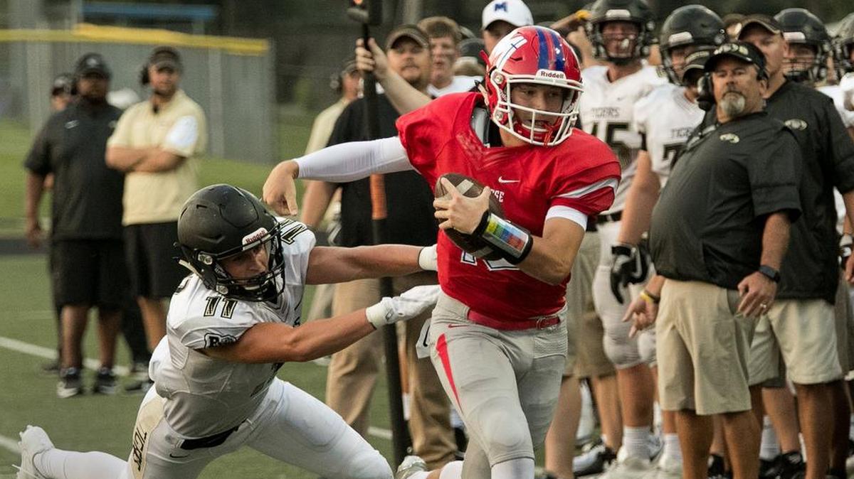 Bishop Miege, led by quarterback Carter Putz (right), is set to face Altamont-Labette County in the Kansas Class 4A-Division 1 football quarterfinals on Friday.