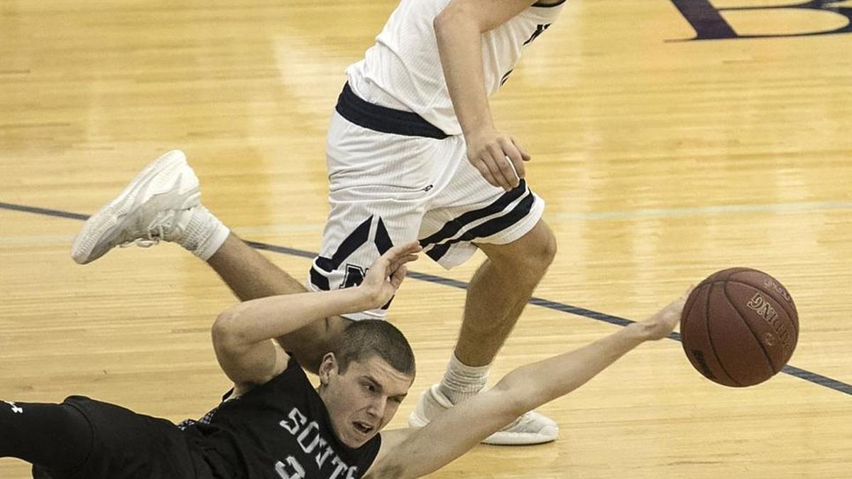 Conner Lee (front) of Park Hill South and Colby Bullock of Blue Valley North, battled for the ball. Park Hill South won 46-31.
