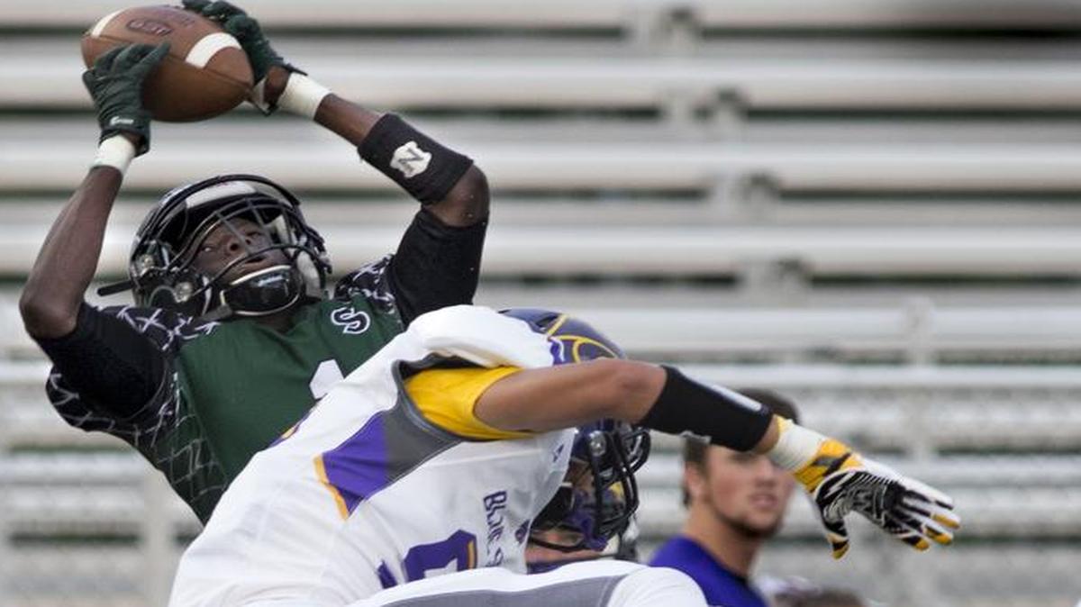
Staley defensive back Gore Pitia (top) picked off a pass intended for Blue Springs wide receiver Tristan Williams during the first quarter of their game on Friday night. Staley blanked the Wildcats, 35-0.
