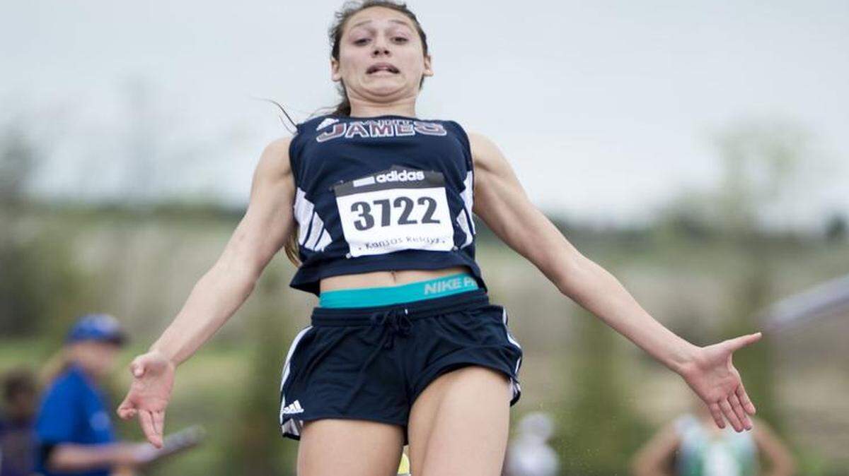 
Kelly McKee of St. James Academy soared into the air during the long jump competition on Friday at the Kansas Relays at Rock Chalk Park in Lawrence.
