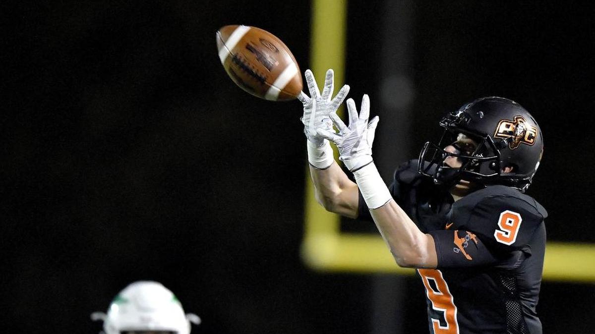 Platte County’s Dylan Gilbert caught pass for a first down during the second quarter against Smithville on Friday night in Platte City, Mo.