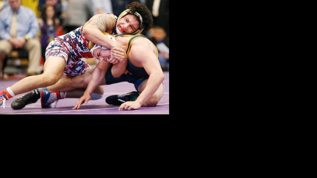 
Olathe North High School’s Isaac Dulgarian (top) beat Wichita Northwest’s Saul Ortiz in the Kansas Class 6A 170-pound state championship match on Saturday. It was his third state title.
