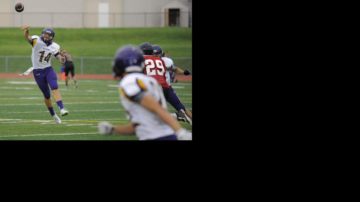 
Kearney quarterback Johnny Weidmaier threw a pass during a scrimmage against Truman on Friday at a jamboree at Truman High School.

