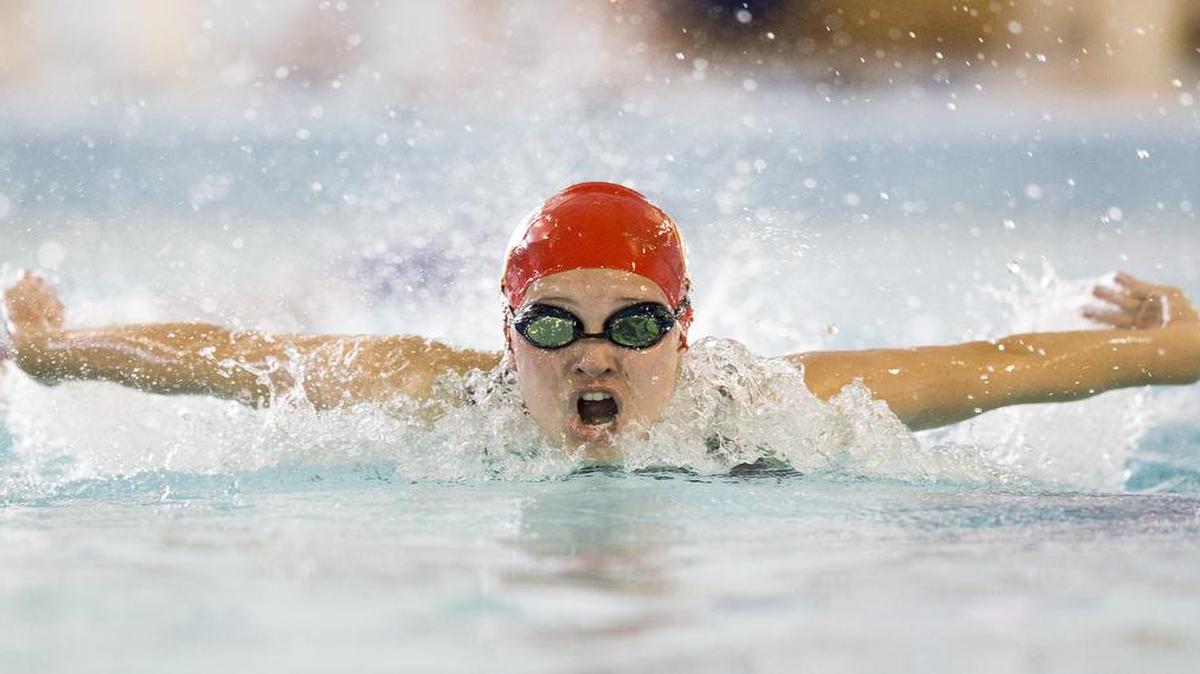 Christine Harpe of Winnetonka competed in the 100-yard butterfly at the Suburban Blue Conference meet on Saturday at the Gladstone Community Center.