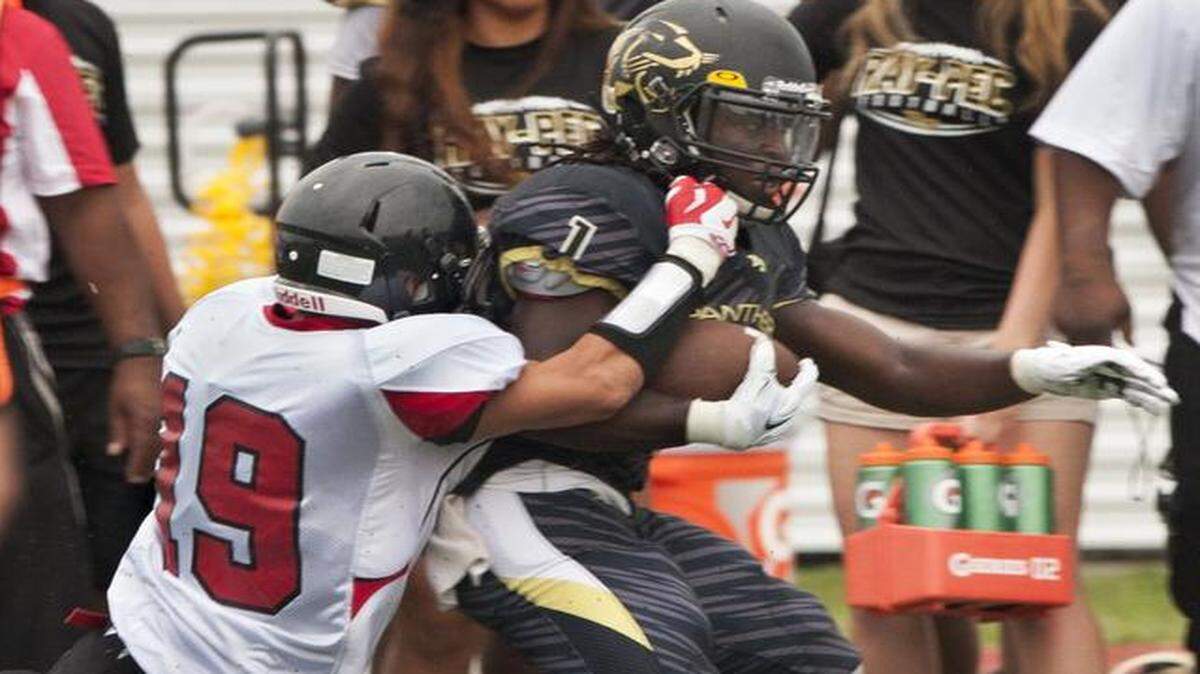 
Jeremiah Acker of Park Hill tackled Isaiah Truss of Raymore- Peculiar during the high school football jamboree on Aug. 15.
