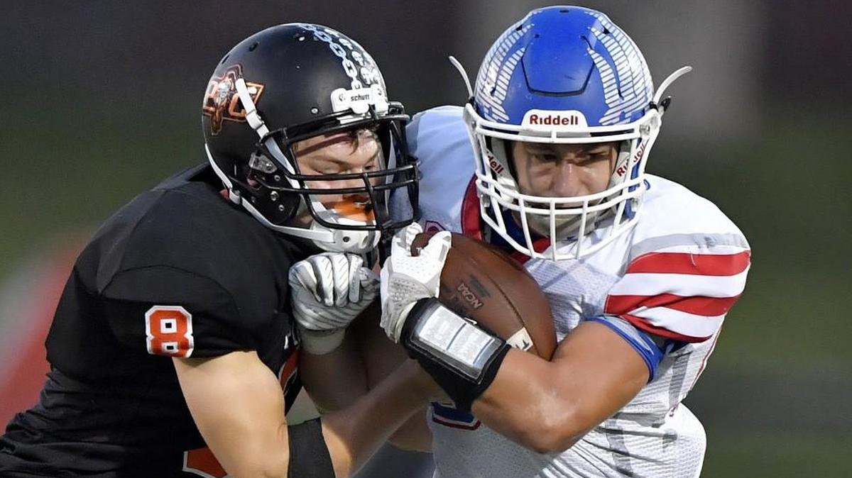Liberty running back Robert Rawie, right, earned Suburban Red Conference Offensive Player of the Year honors.
