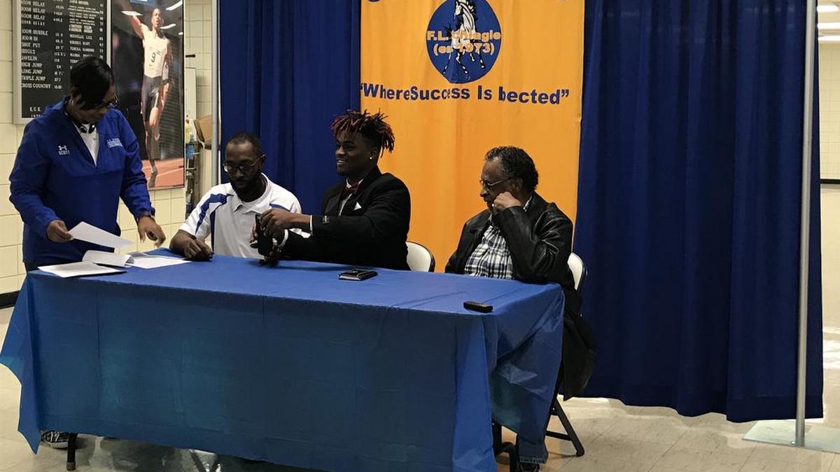Schlagle running back Ivan Webb (center) signed with Missouri State football during the NCAA’s early signing period.