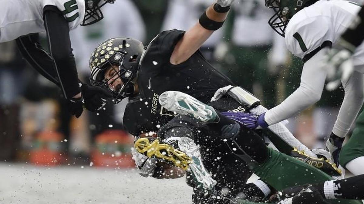 It was an icy landing for Blue Valley’s Tanner Fox when he was dragged down while returning a kickoff against Derby in Saturday’s Kansas 6A title game in Emporia, Kan.