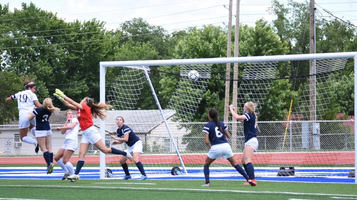 Sinclaire Miramontez (left) of Shawnee Mission West headed in a corner kick for the game-winning goal in the Vikings’ 1-0 overtime victory over Manhattan in a Kansas 6A state semifinal match on Saturday in Junction City, Kan.