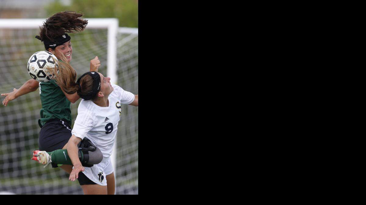 
Jamie Kutey (right) of St. Thomas Aquinas
