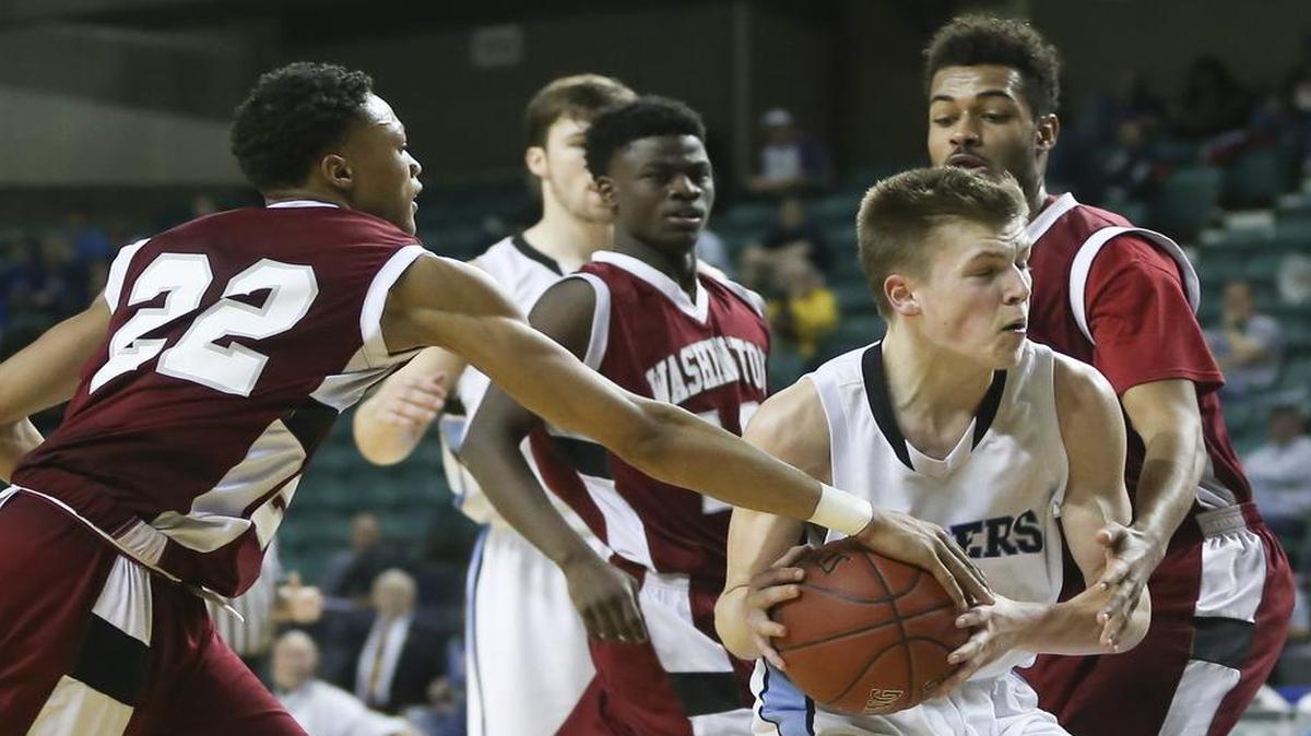 Washington’s DeMarco Smith stripped the ball from Goddard’s Dylan Vincent on Wednesday in their Kansas Class 5A state quarterfinal in Topeka.