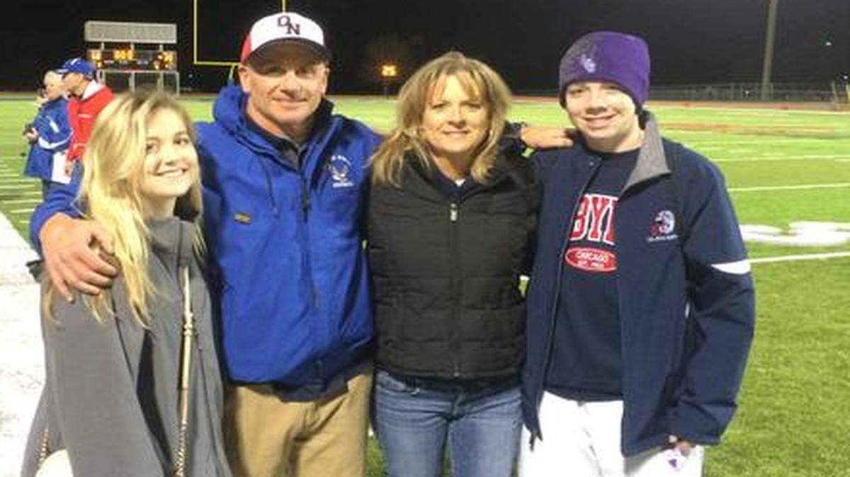 
New Olathe North football coach Chris McCartney with his wife, Julie, and their daughter, Morgan, and son, Connor.
