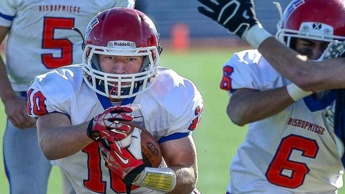 
Bishop Miege’s Dawson Downing, who ran for 154 yards and scored three touchdowns, rumbled for yardage against Topeka Hayden on Saturday in Topeka.

