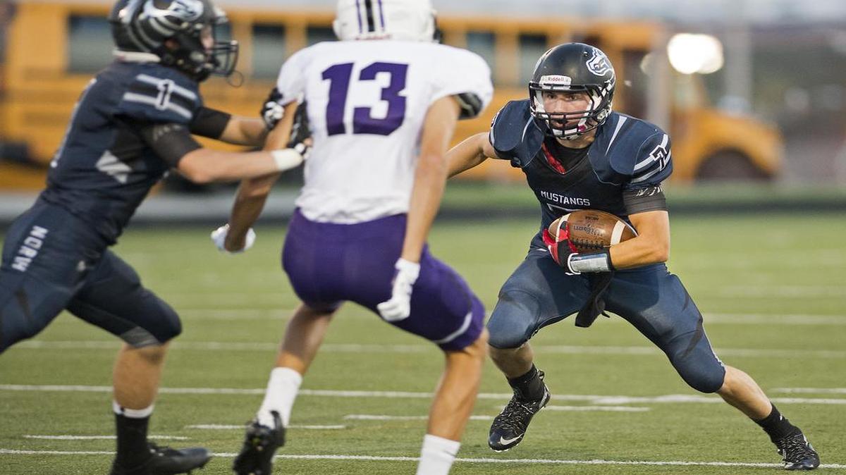
Blue Valley North’s Jack Gordon (right) took advantage of a block by teammate Calvin Masters on Blue Valley Northwest’s Matthew Fischbach in Friday’s game.


