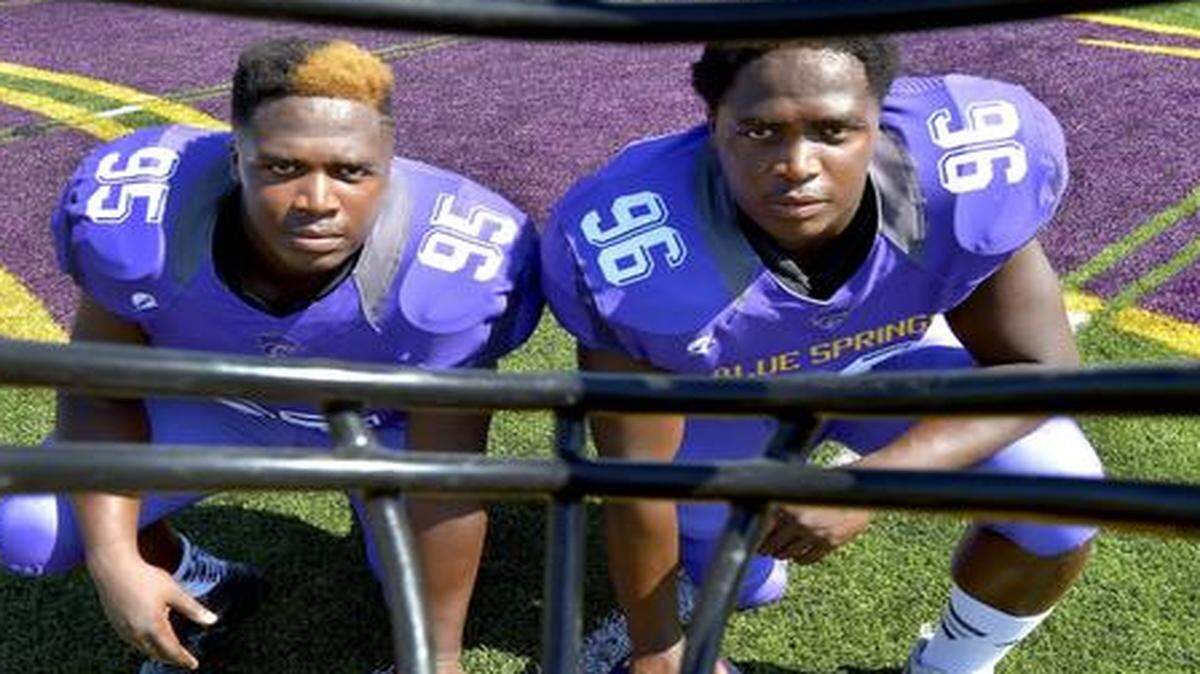 
Twin brothers Khalil (left) and Carlos Davis, defensive tackles at Blue Springs High School, have reopened their college commitment.
