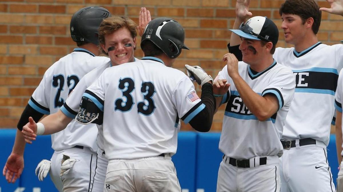 Shawnee Mission East Henry Churchill was congratulated by his teammates after his two-run single in the sixth inning during a game against Wichita West in the Kansas 6A quarterfinals Friday in Lawrence.