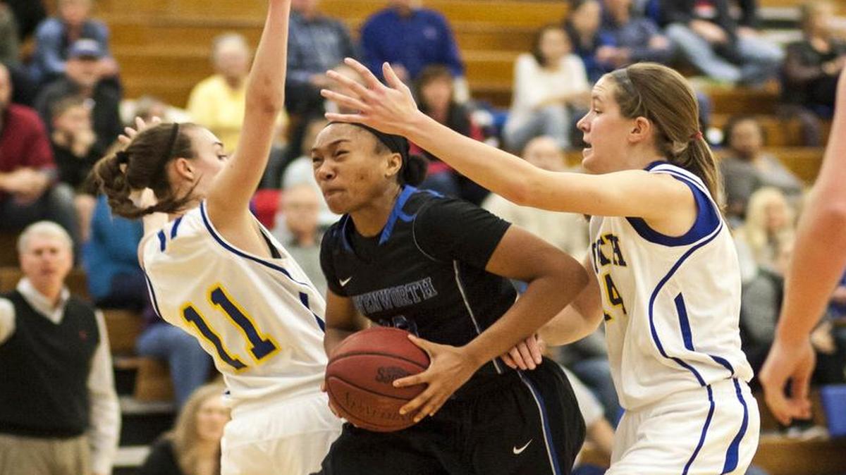 It usually a tight game whenever Olathe South and Leavenworth hook up in a girls high school basketball game. Olathe South’s Zoe Matje (left) and Kacey Kennett (right), seen here against Leavenworth last year, will face off against the Pioneers once again on Friday night.
