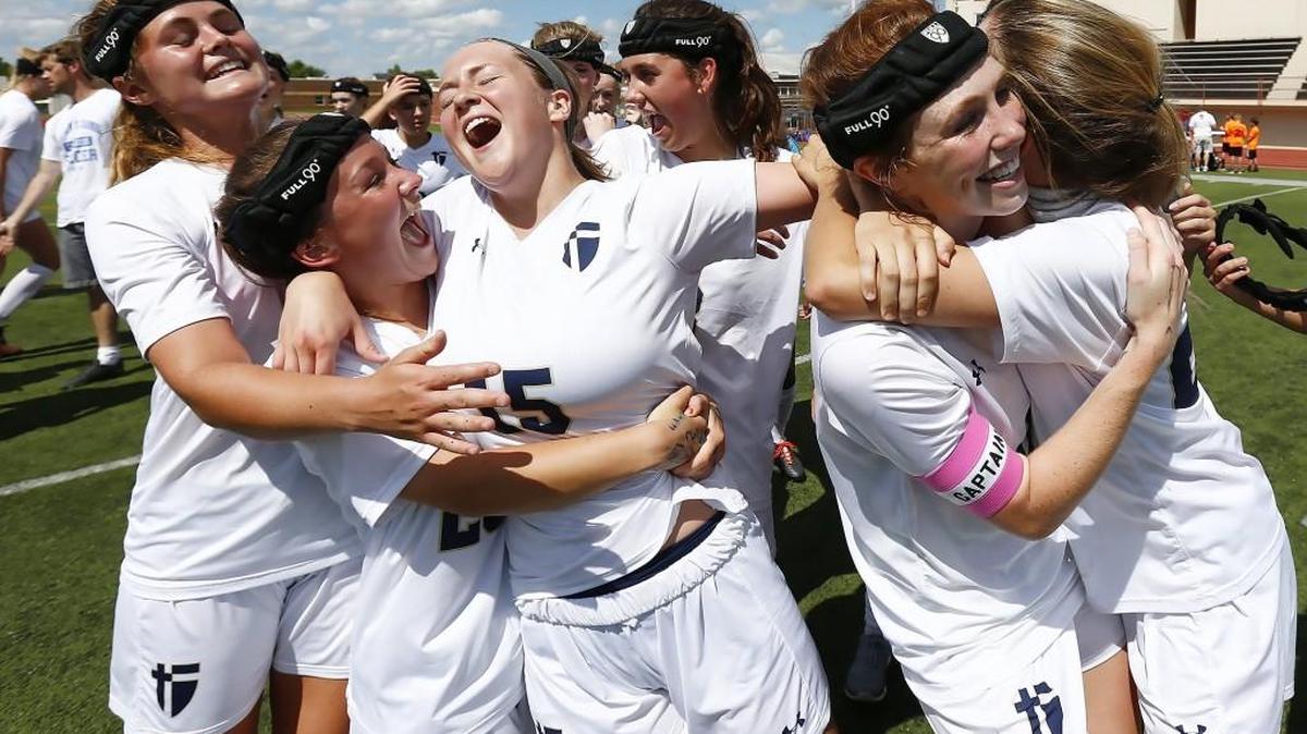 St. Thomas Aquinas players celebrate after winning the 5A state soccer championship in which they defeated Kapaun Mount Carmel 5-0 Saturday at Andover, Kan.