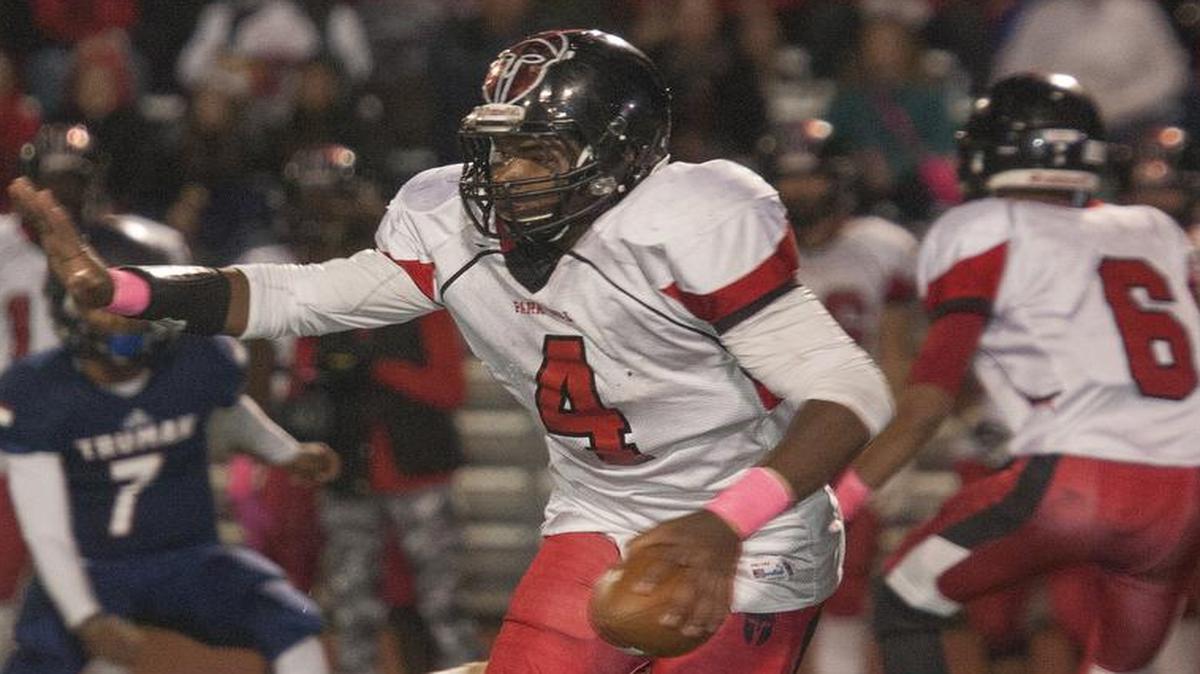 
Park Hill’s Chester Graves found a hole in the Truman defense during first-half action in their game on Friday night at William Chrisman High School. Park Hill defeated the Patriots.
