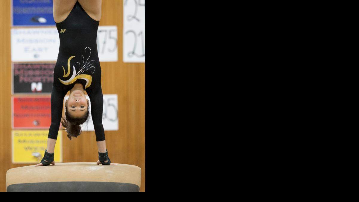 
Maddie Ricketts of Shawnee Mission West High School competes on the vault on Saturday at the KSHSAA Gymnastics State Championship.
