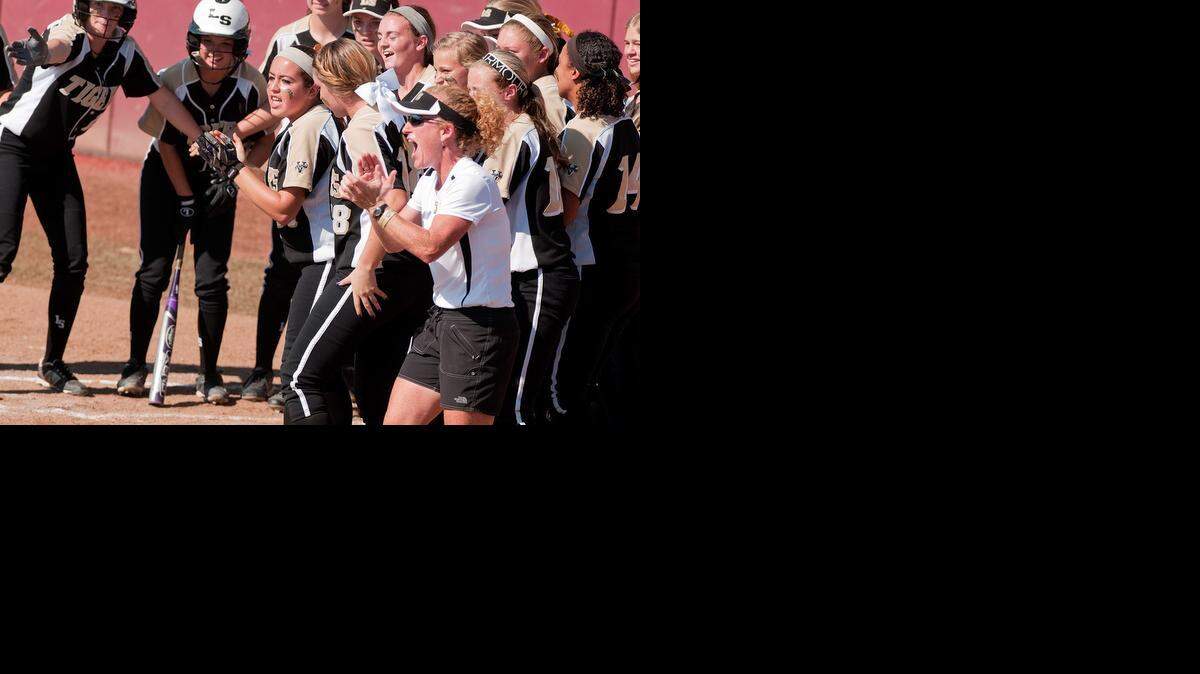 
Coach Tracy Bertoncin and her Lee’s Summit Tigers were fired up after Emily Robinson belted a home run Saturday against the Holt Lady Indians at the Killian Sports Complex in Springfield. Lee’s Summit finished the season with a record of 26-6. 
