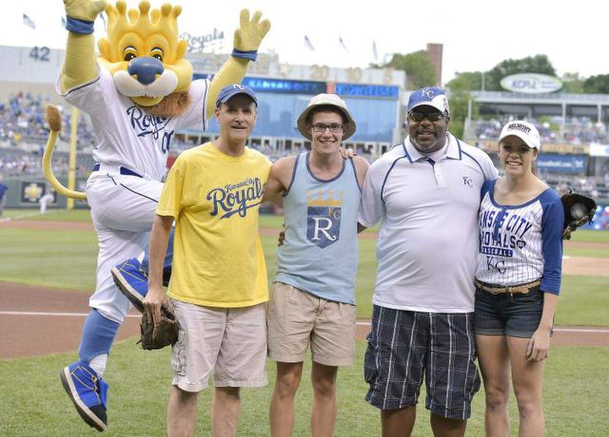 The Star’s 2014 Scholar-Athletes threw out a first pitch before a Royals game that summer at Kauffman Stadium. BV Northwest’s Sam Guinn (second from left) threw to his father, Rick (left), while Barstow’s Arianna Person (far right) threw to her father, Lorenzo (second from right).