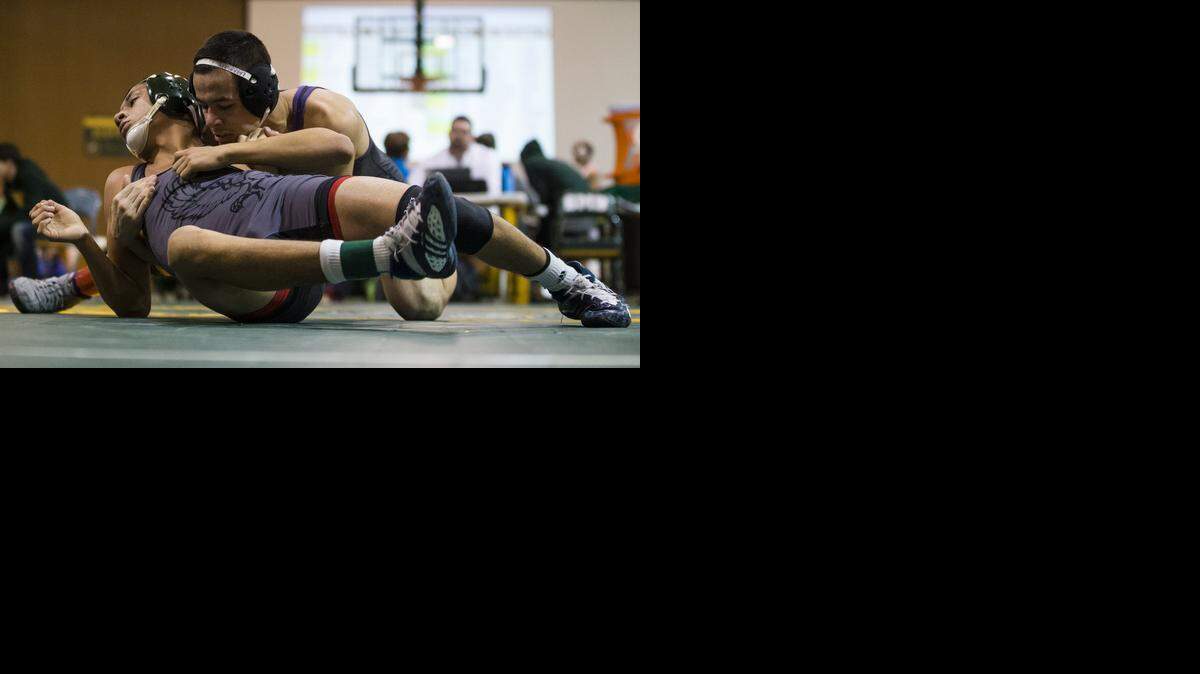 
Jason Laramore (back) of Blue Valley Northwest High School defeated Isaiah Jacobs of Lawrence Free State in the 126-pound championship match on Saturday at the Shawnee Mission South Invitational.

