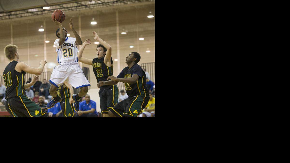 
Mylan Collins of Lincoln Prep goes up for a shot against O’Hara on Friday during their game in the William Jewell Holiday Classic in Liberty.
