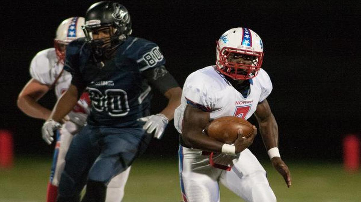 Olathe North running back Vinnie Shabazz finds open room and runs 36 yards for a touchdown on Friday night in the Eagles’ 35-28 victory over Blue Valley North.