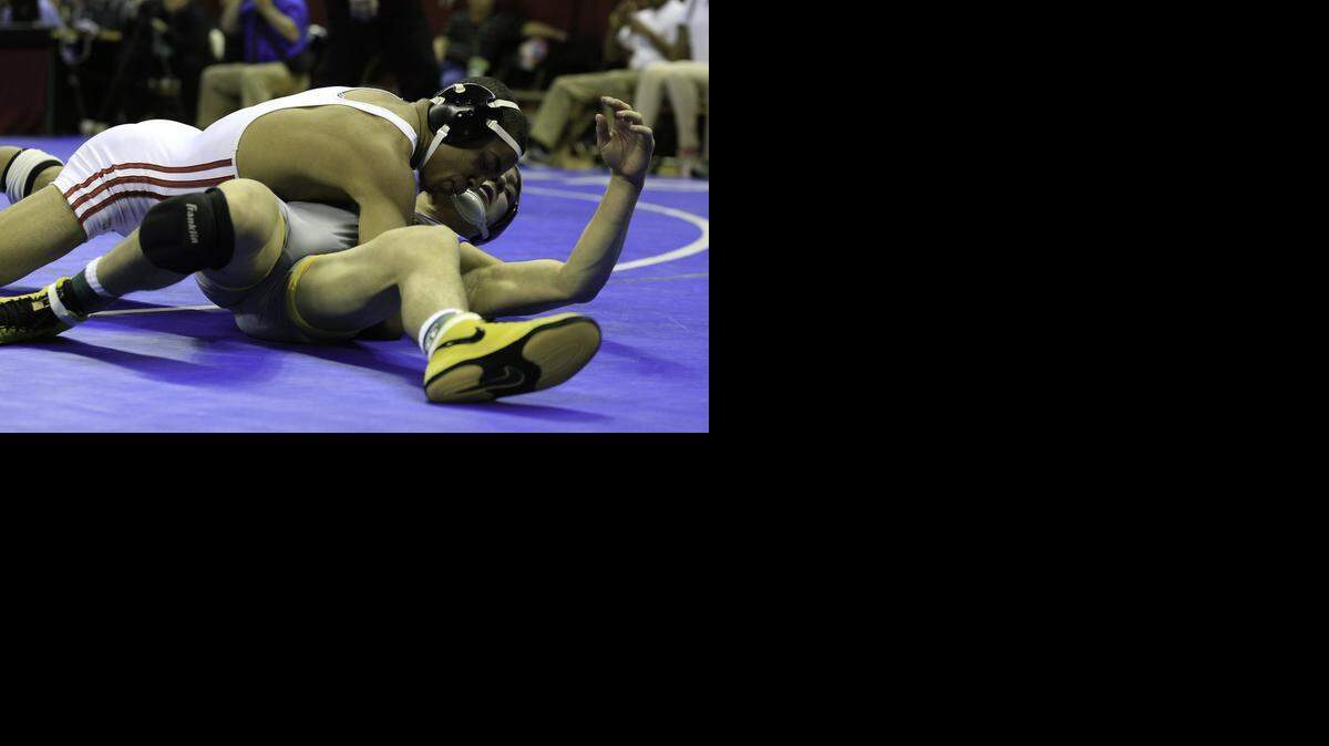 
Ke-Shawn Hayes (top) of Park Hill defeated Nick McGhee of Francis Howell in the Missouri Class 4 138-pound state championship match on Feb. 21 at Mizzou Arena in Columbia.
