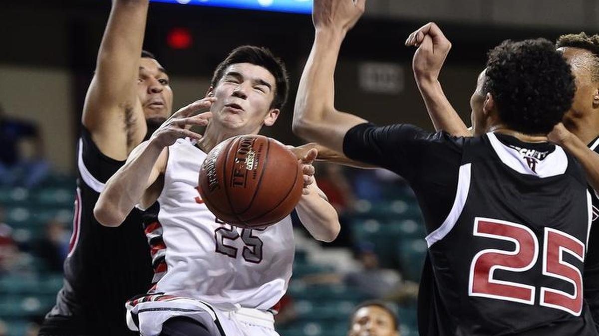 Blue Valley West’s Michael Chalupa (with ball), seen here in last year’s Kansas 5A state tournament, scored eight points in a 48-46 victory last week over St. Thomas Aquinas.