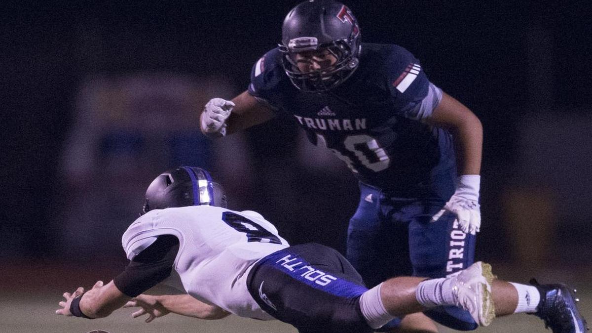 
Park Hill South’s Zach Suchanick (bottom) dove to recover a fumble in front of Truman’s Hector Navarrete during third-quarter action of their game on Friday night. Truman won 27-21.
