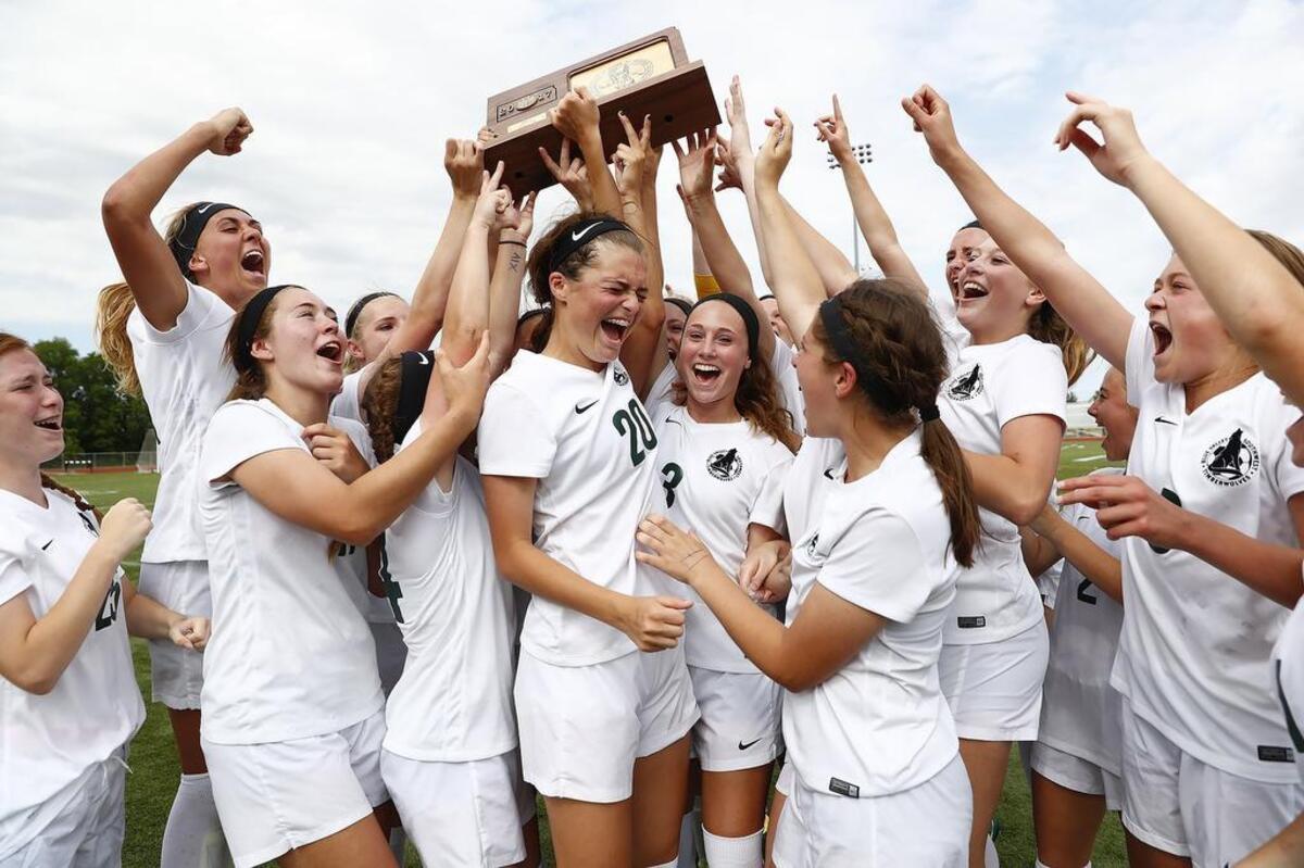 The Blue Valley Southwest soccer team celebrated its 2-0 victory over St. Thomas Aquinas on Saturday in the 5A state soccer championship game.