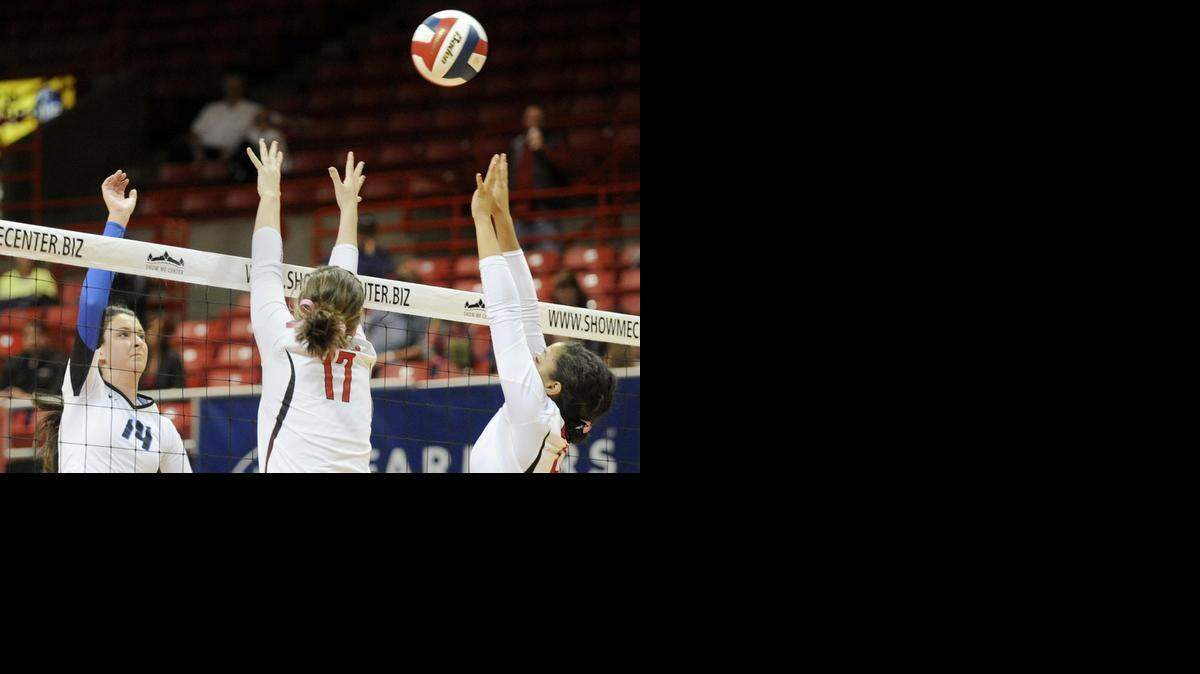 
Liberty’s Madison Duello (left) watched her shot get past Ozark players during their match at the Missouri Class 4 state tournament in November. Duello is The Star’s All-Metro Volleyball Player of the Year.
