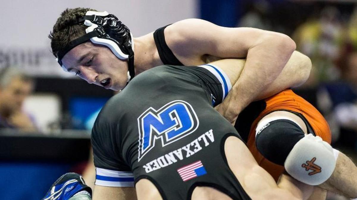 Matthew Schmitt (right) of Platte County beat Mavrick Alexander of Grain Valley in a championship match on Saturday at Mizzou Arena during the Missouri high school wrestling state tournament.