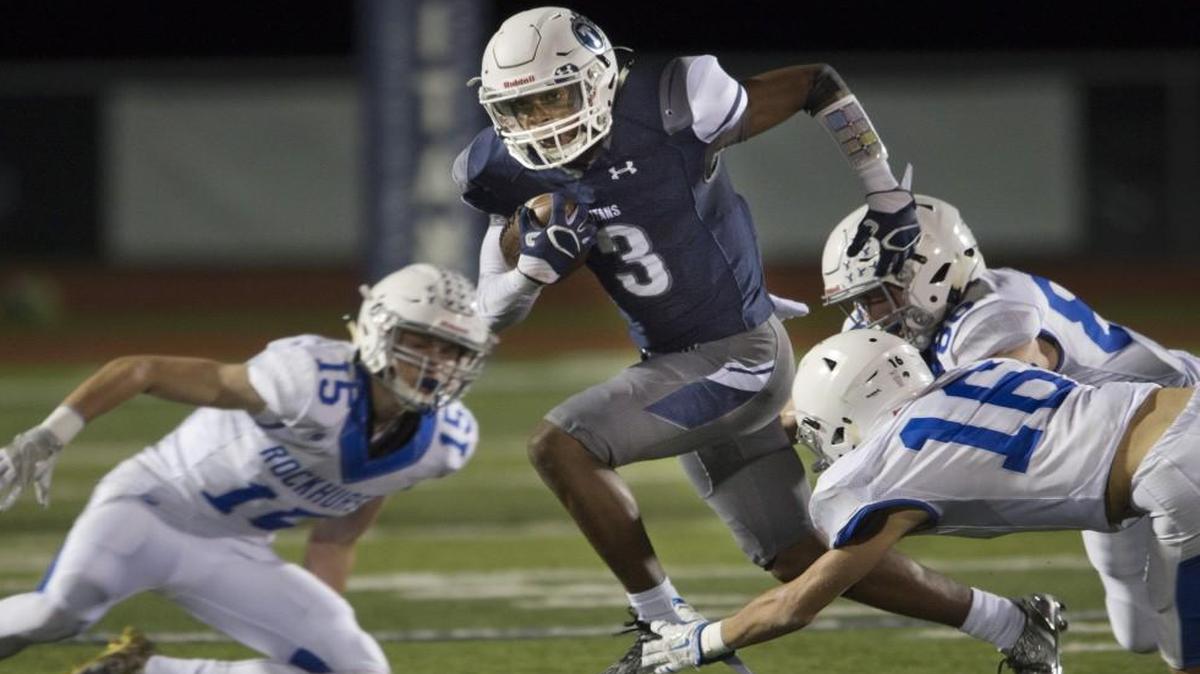 Lee’s Summit West senior Mario Goodrich, center, who has committed to Nebraska, plays on both sides of the football for the Titans this season. He is the state’s fourth-ranked recruit.