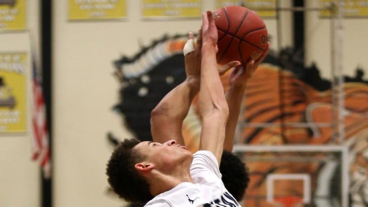Christian Bishop (front) came up big inside for Lee’s Summit West on Friday night against LS North.