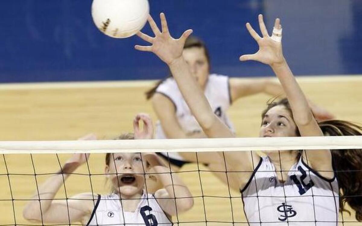 St. James Academy players Jenna Gray (left) and Audriana Fitzmorris are the Kansas Volleyball Coaches Association Class 5A all-state co-players of the year.
