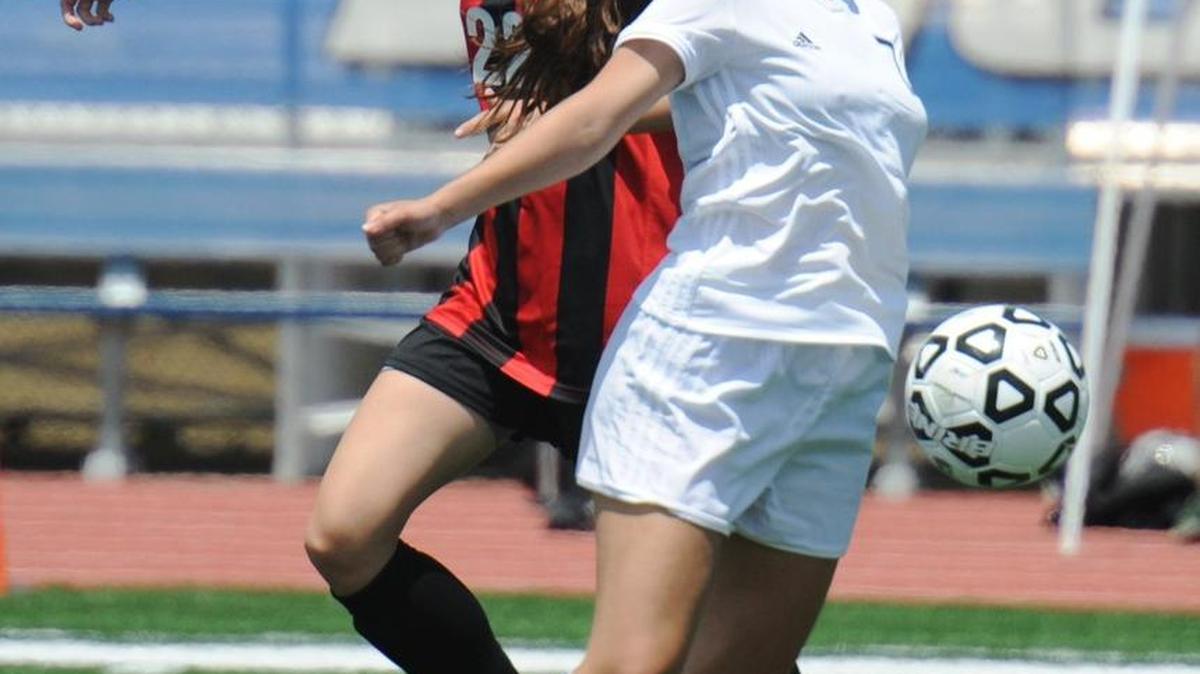 Blue Valley West's Shelby Christopherson (left) was selected the Eastern Kansas League’s midfielder of year after helping the Jaguars win the Kansas Class 6A state championshp.